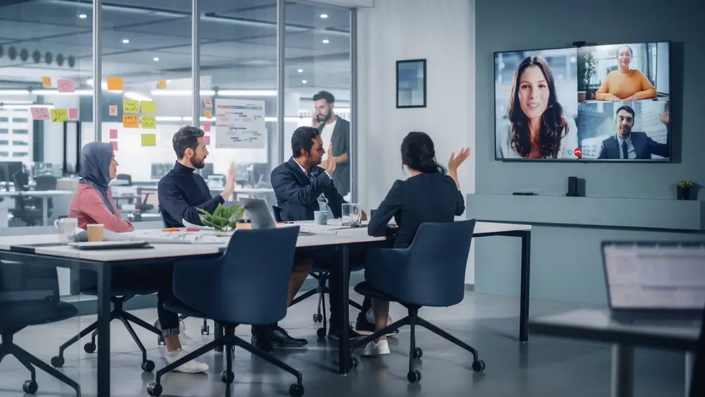 HR team meeting using digital technology for recruitment and onboarding